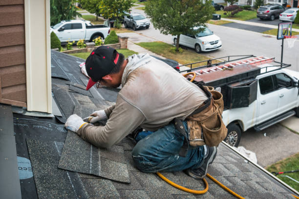 Professional Roofing technician working in Powderly, KY